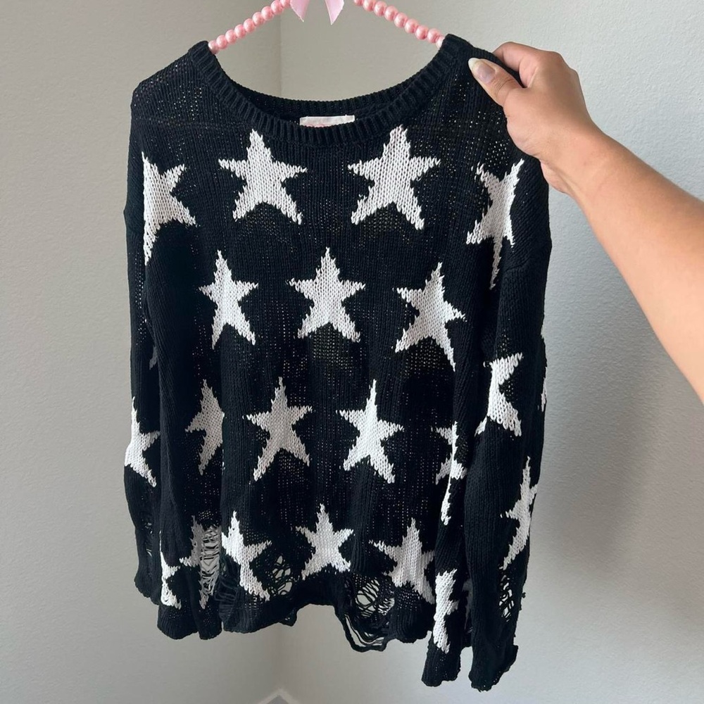black and white star print distressed sweater